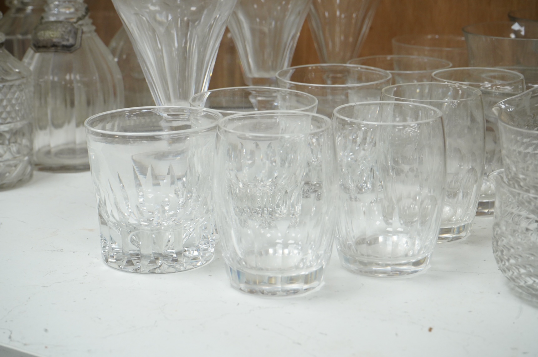 A collection of 19th century and later glassware, to include: Three fluted wine glasses two rummers, various risers and finger bows, decanters etc